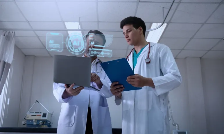 Two healthcare professionals reviewing patient data on a laptop with AI interface overlays in a clinical setting.