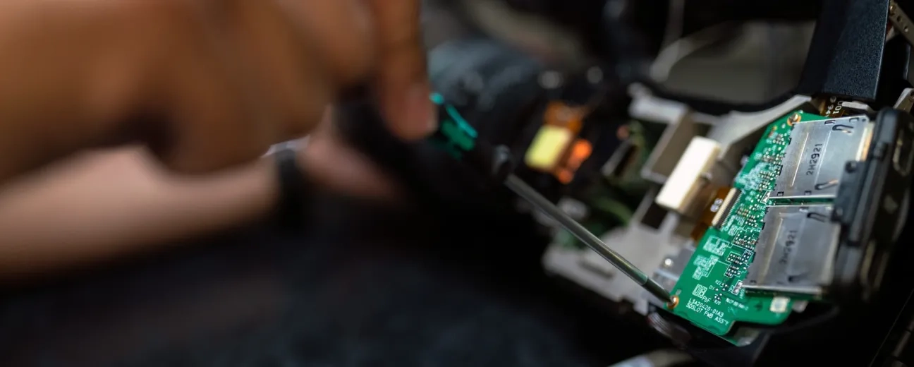 person holding circuit board