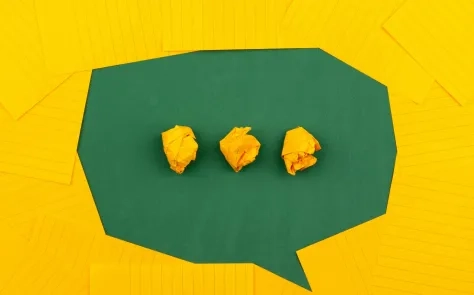 three dots on green background