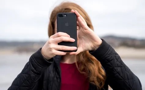 person holding mobile device