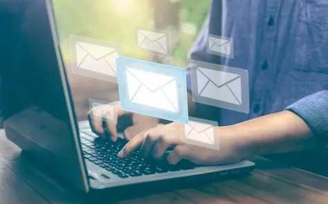 person typing on laptop keyboard