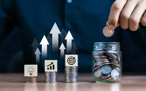 Businessman using tablet analyzing sales data and economic growth graph chart. Business strategy. Abstract ico