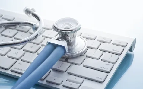 stethoscope on computer keyboard