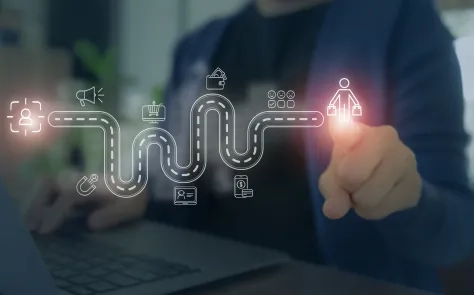 Person pointing at a digital customer journey map with icons representing personalization and user experience.