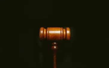 brown wooden stand with black background