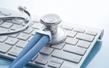 stethoscope on computer keyboard